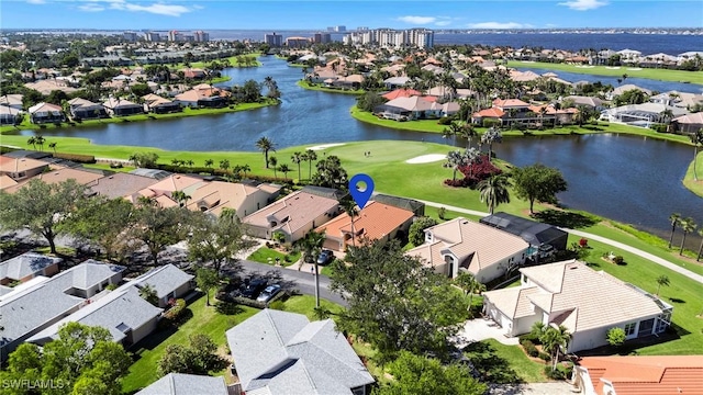 bird's eye view with a residential view and a water view