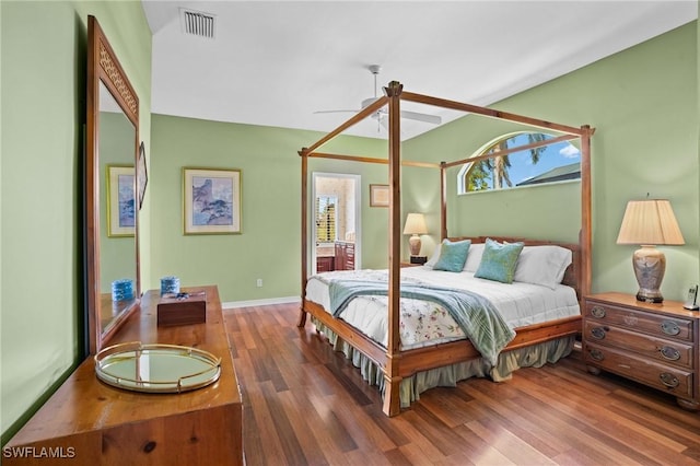 bedroom with a ceiling fan, baseboards, visible vents, and wood finished floors