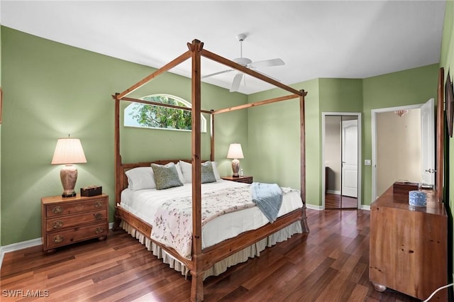 bedroom with a ceiling fan, baseboards, and wood finished floors