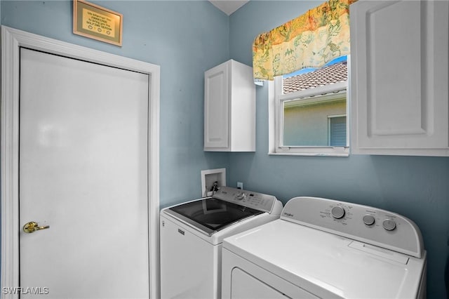 laundry room featuring cabinet space and washer and dryer