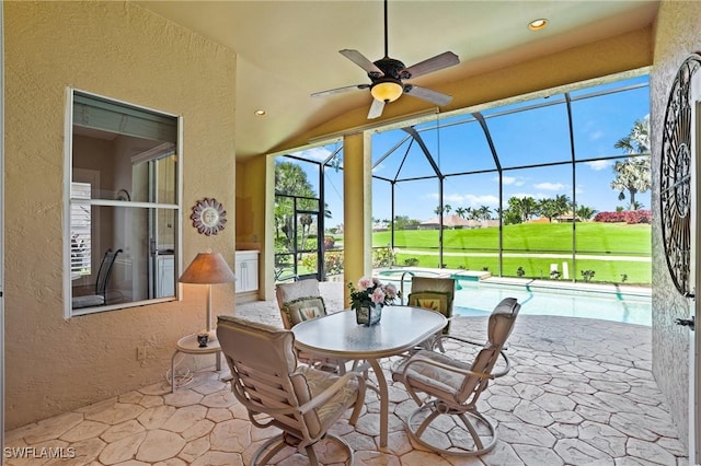 view of patio featuring ceiling fan, a lanai, and an outdoor pool