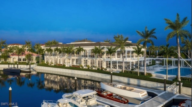 view of pool featuring a dock and a water view