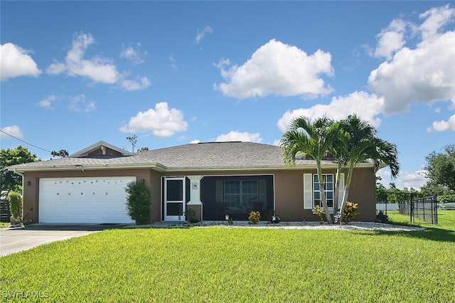 single story home featuring a garage, a front yard, driveway, and stucco siding