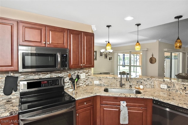 kitchen with appliances with stainless steel finishes, decorative backsplash, a sink, and crown molding