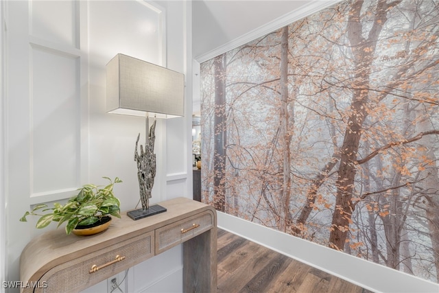 bathroom featuring ornamental molding and wood finished floors