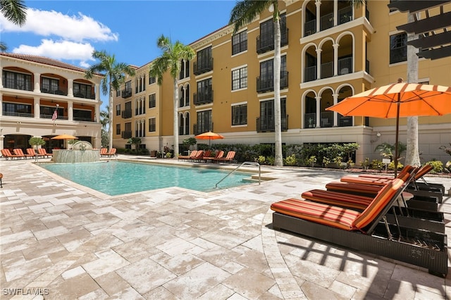 pool with a patio area