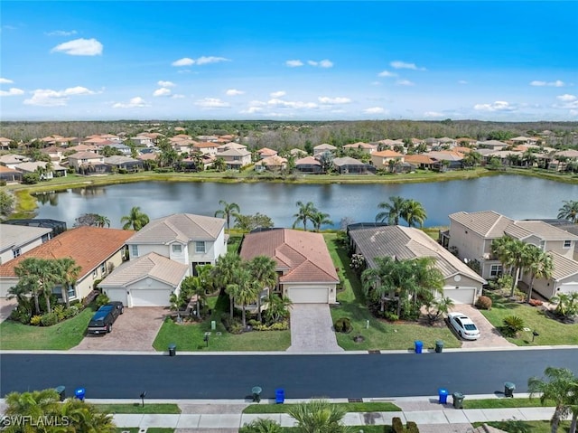 bird's eye view featuring a water view and a residential view