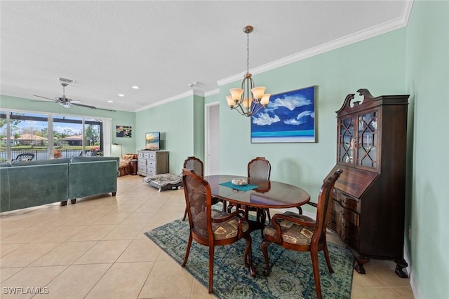 dining space with light tile patterned flooring, crown molding, and ceiling fan with notable chandelier