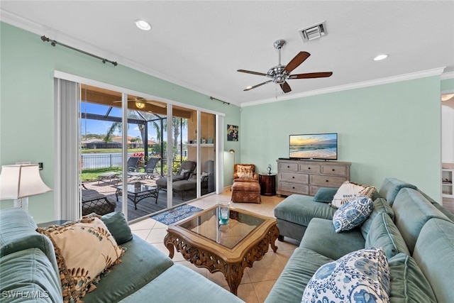 living area featuring crown molding, a ceiling fan, visible vents, and tile patterned floors