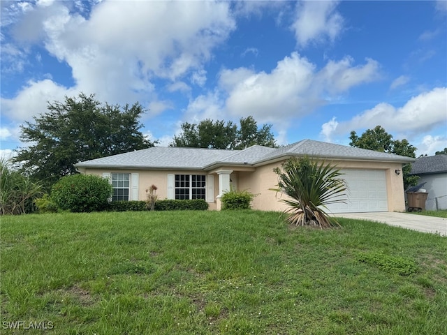 single story home with an attached garage, driveway, a front lawn, and stucco siding