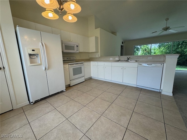 kitchen featuring white appliances, white cabinetry, a sink, and light tile patterned floors