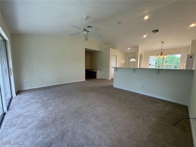 unfurnished living room with recessed lighting, baseboards, carpet flooring, and ceiling fan with notable chandelier