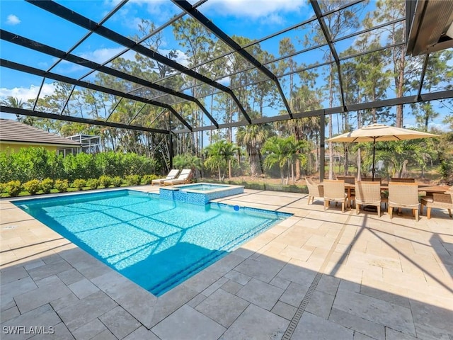 view of pool featuring a patio, glass enclosure, outdoor dining space, and a pool with connected hot tub