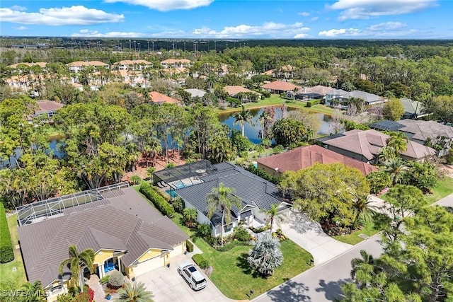 birds eye view of property with a residential view and a water view