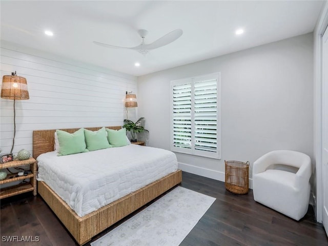 bedroom featuring baseboards, a ceiling fan, wood finished floors, and recessed lighting