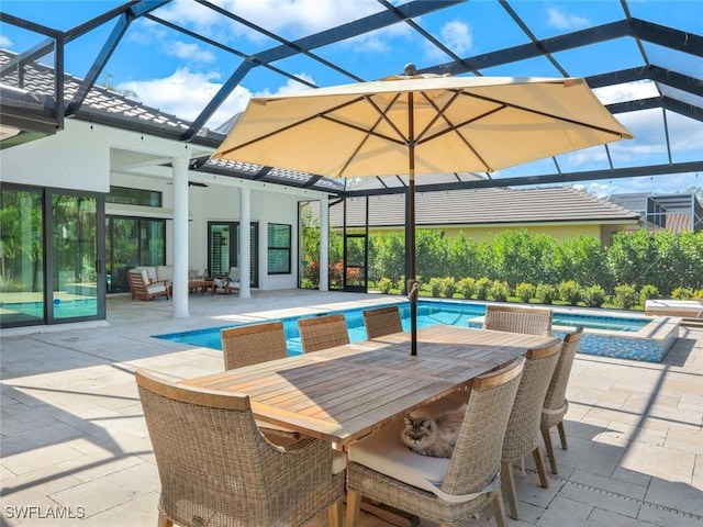 view of swimming pool with glass enclosure, a pool with connected hot tub, an outdoor hangout area, and a patio