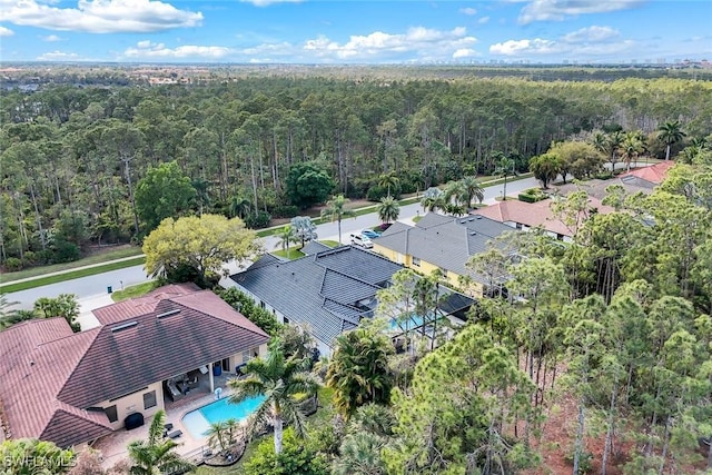 aerial view with a wooded view