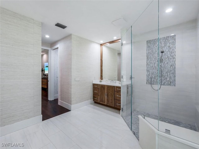 full bath featuring recessed lighting, a shower stall, visible vents, and vanity