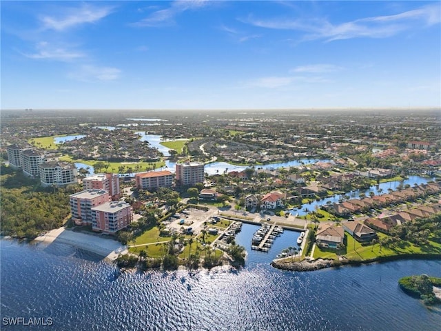 drone / aerial view featuring a water view and a view of city