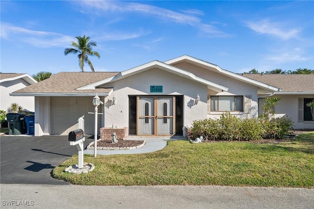 ranch-style house featuring aphalt driveway, roof with shingles, stucco siding, an attached garage, and a front lawn