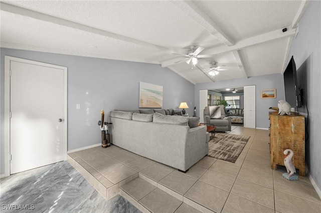 living area featuring light tile patterned floors, baseboards, a ceiling fan, lofted ceiling with beams, and a textured ceiling