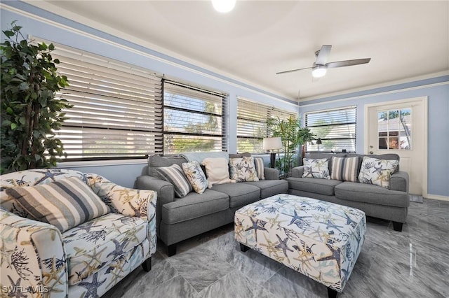 living area featuring marble finish floor and a ceiling fan