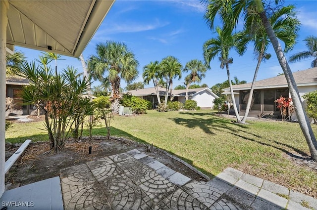 view of yard featuring a sunroom