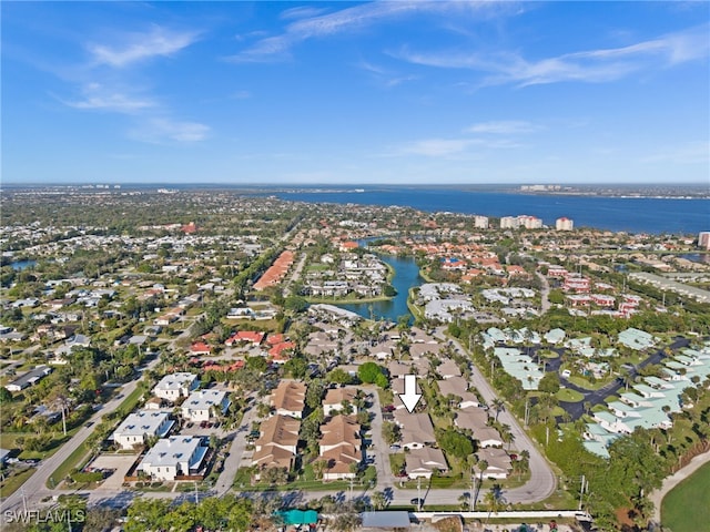 aerial view with a residential view and a water view