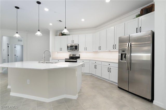 kitchen featuring stainless steel appliances, a sink, visible vents, white cabinetry, and ornamental molding