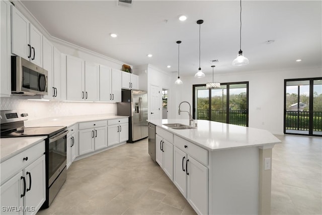 kitchen with crown molding, backsplash, appliances with stainless steel finishes, white cabinetry, and a sink