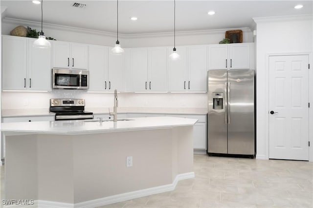 kitchen with light countertops, visible vents, appliances with stainless steel finishes, ornamental molding, and a sink