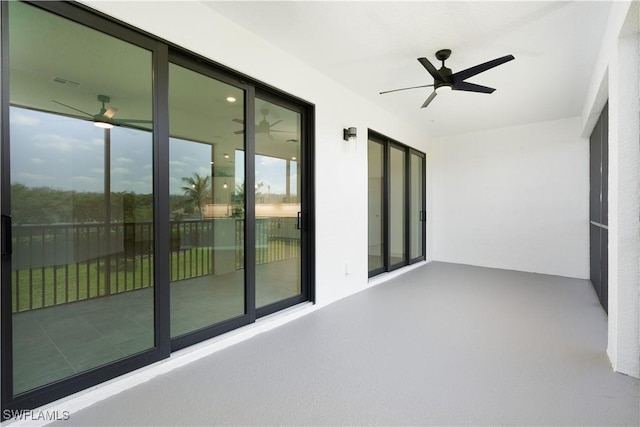 exterior space with a ceiling fan and a wealth of natural light