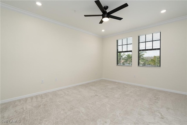 carpeted spare room featuring baseboards, recessed lighting, and crown molding