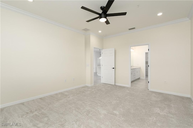 unfurnished bedroom with light carpet, baseboards, crown molding, and recessed lighting