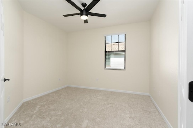 empty room with carpet floors, ceiling fan, and baseboards