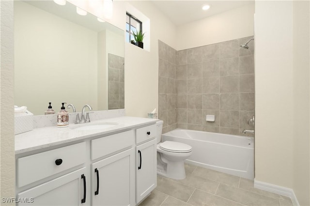 full bathroom featuring baseboards, toilet, tile patterned flooring, vanity, and washtub / shower combination