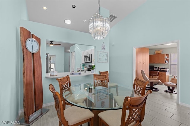 dining room with baseboards, light wood-style floors, visible vents, and recessed lighting