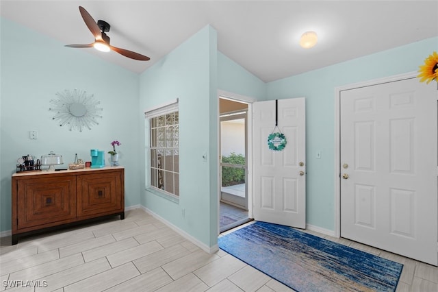 foyer featuring baseboards, a ceiling fan, and wood finish floors