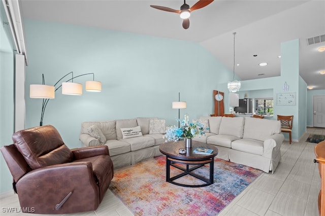 living room with visible vents, vaulted ceiling, and a ceiling fan