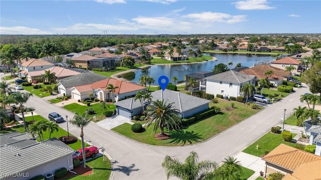 aerial view featuring a water view and a residential view