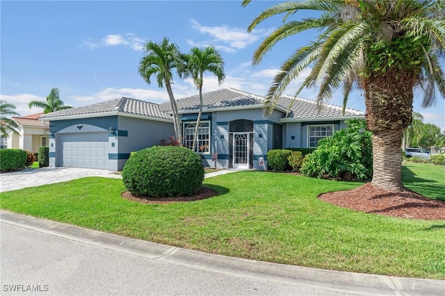 view of front of house featuring decorative driveway, stucco siding, an attached garage, a tiled roof, and a front lawn