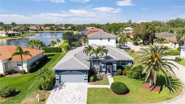 drone / aerial view with a water view and a residential view