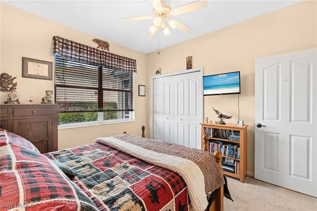 bedroom with a closet, a ceiling fan, and light colored carpet