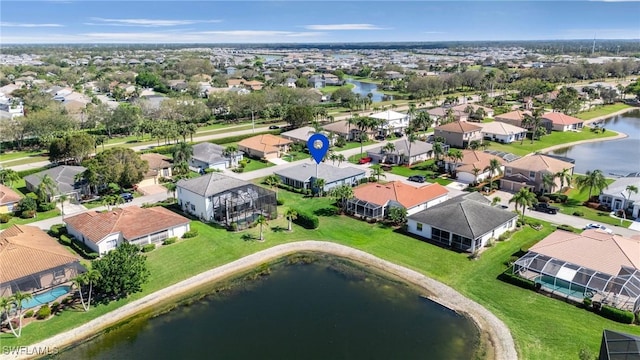 bird's eye view with a water view and a residential view