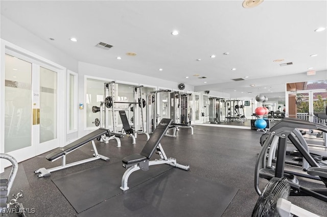 exercise room featuring recessed lighting and visible vents