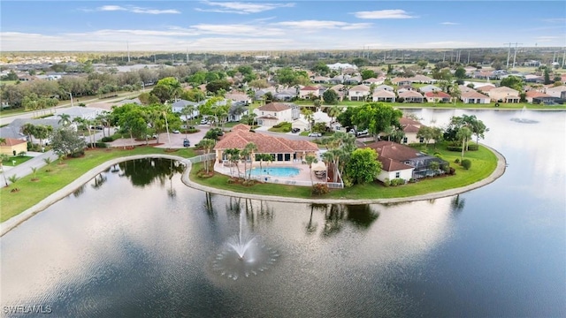 birds eye view of property with a residential view and a water view