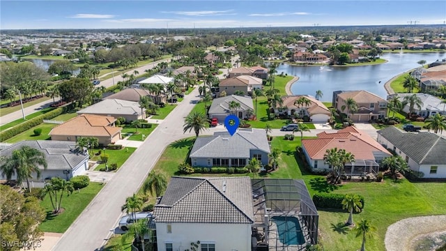 aerial view with a residential view and a water view