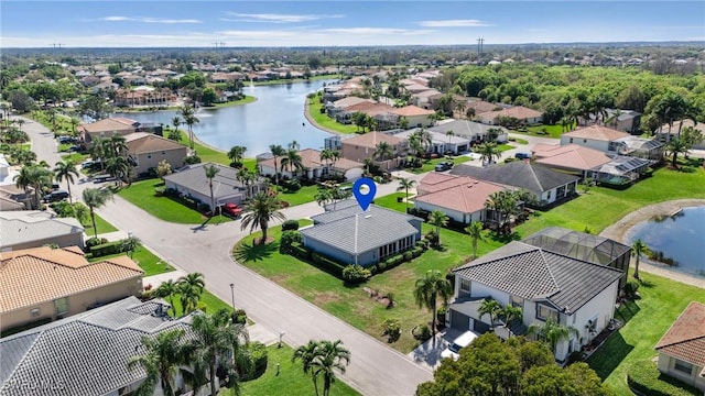 aerial view featuring a residential view and a water view