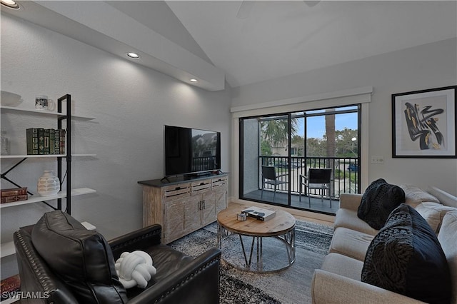 living area with vaulted ceiling and recessed lighting