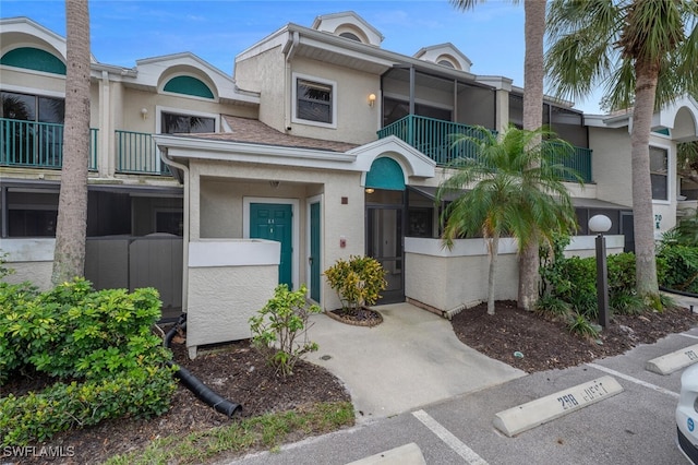 exterior space with uncovered parking and a fenced front yard